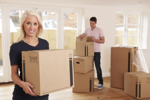 Professional movers loading household items in Perivale