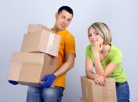 Professional movers loading furniture during house removals in Perivale