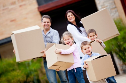 Packed moving boxes and furniture ready for removals in Perivale