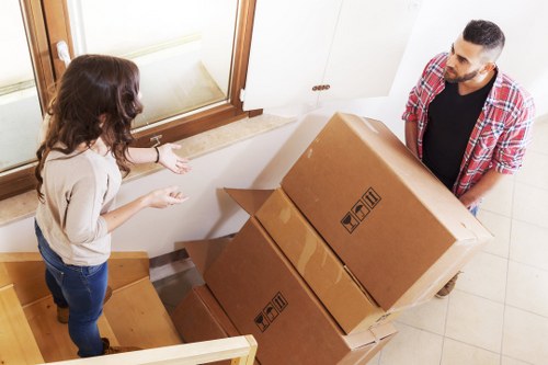 Customer following safe storage practices while handling boxed items