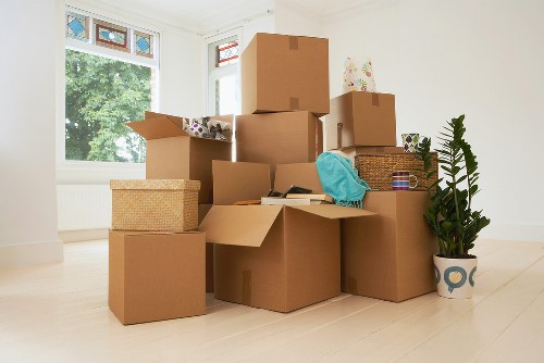 Student packing belongings for storage during a move in Perivale